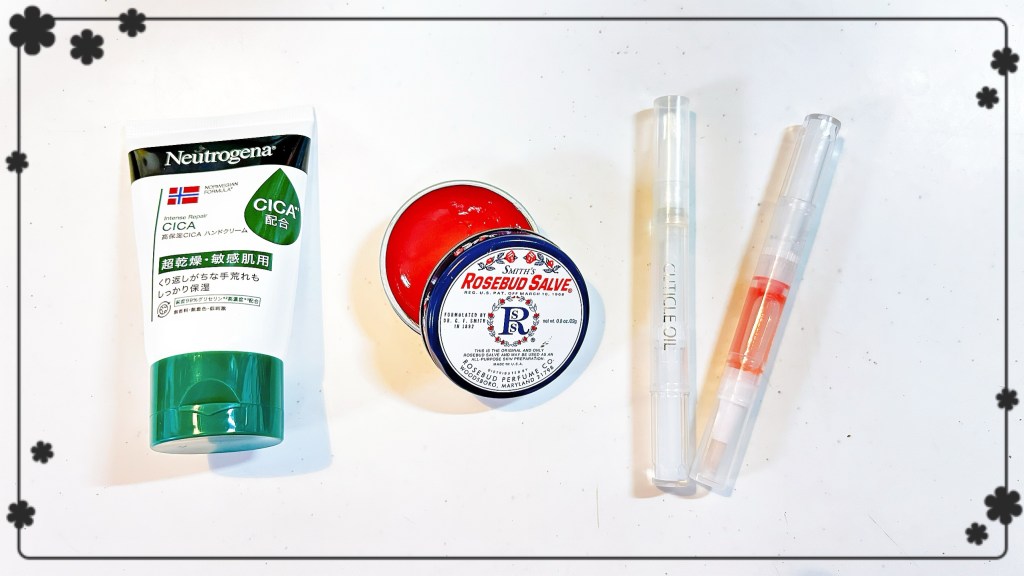 A few of my most-used hand products, which are a tube of Neutrogena CICA hand cream, a small round tin or rose-scented hand salve, and a couple of cuticle oil pens in different "flavors".