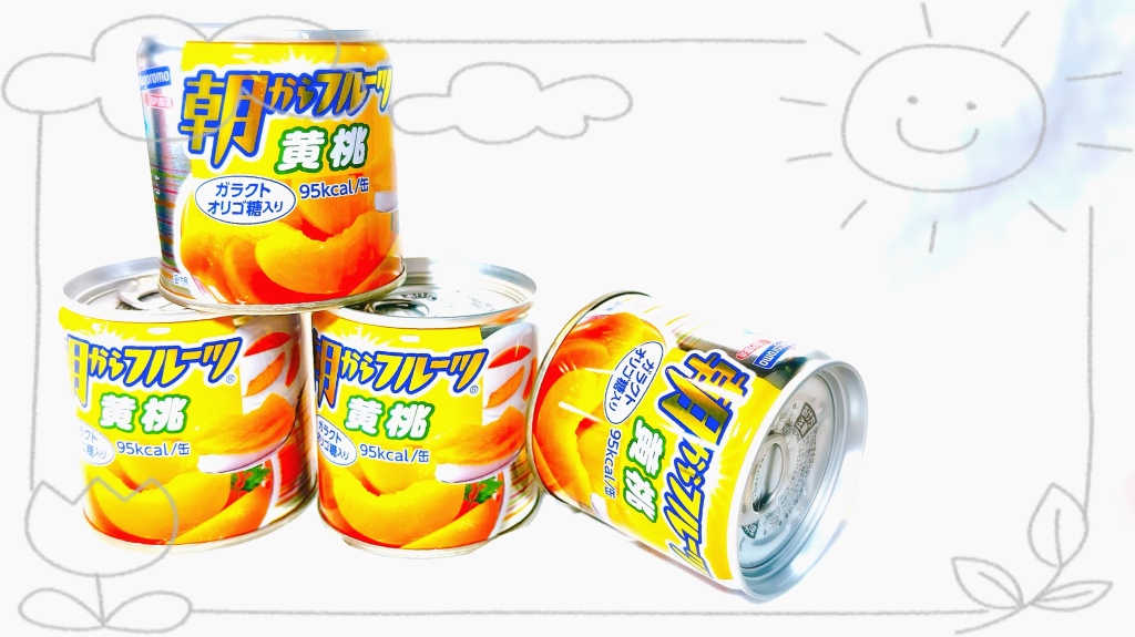 Four small cans of peaches with images of the fruit on the front, and Japanese writing.